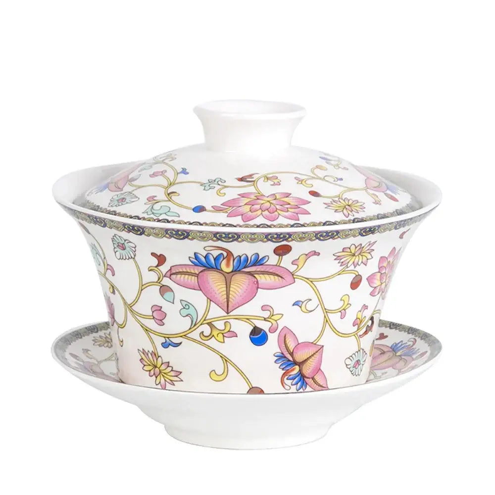 Blue floral white porcelain tea cup set featuring intricate pink blossoms gold vines on a delicate porcelain tea cup