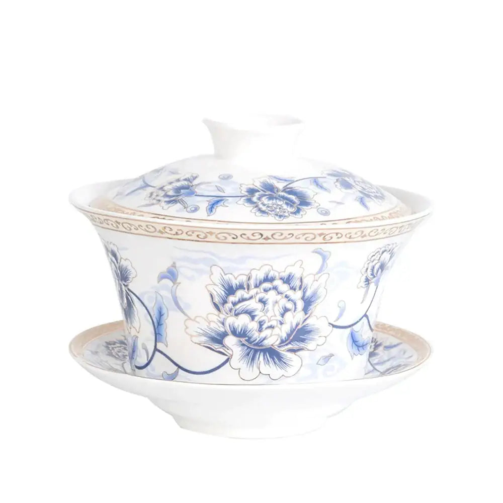 Blue floral white porcelain tea cup set with intricate peony patterns and gold trim for elegant dining room use