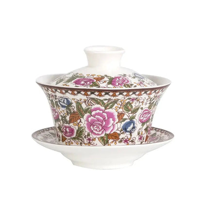 Porcelain tea cup set featuring a lidded bowl and saucer with intricate blue floral patterns on white porcelain
