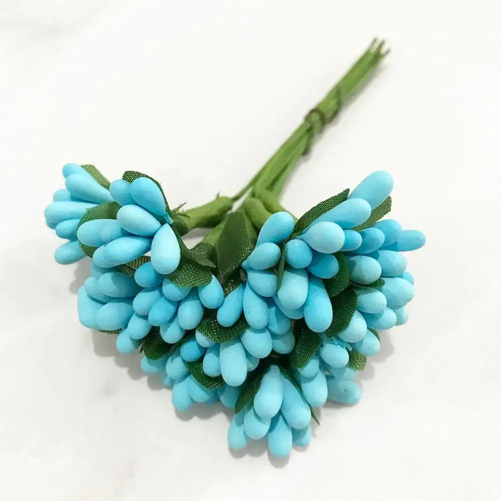 A cluster of decorbites blue flower cherry artificial turquoise paper flowers with green fabric leaves for living room decor