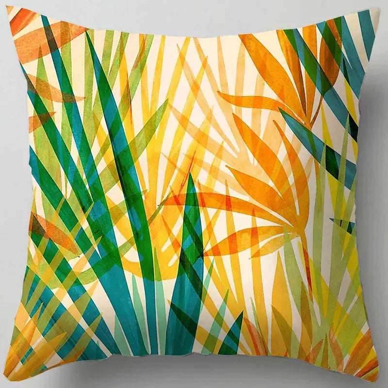 Blue flower leaves pattern cushion cover with vibrant tropical leaf design in green yellow and teal on cream for living room decorbites decor