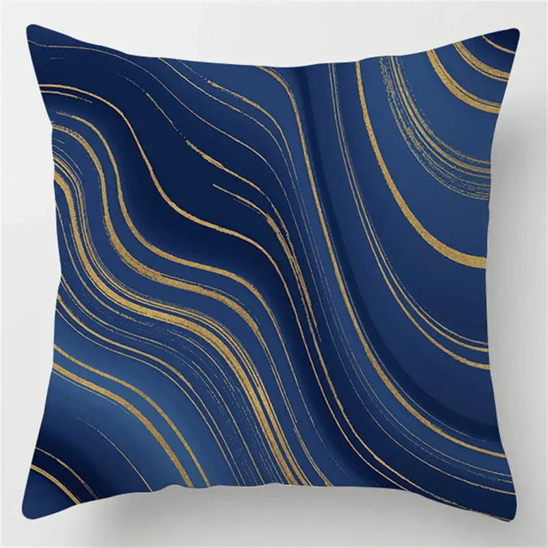 Square throw pillow with deep navy blue background and flowing gold brushstroke patterns for decorbites blue geometric marble decor
