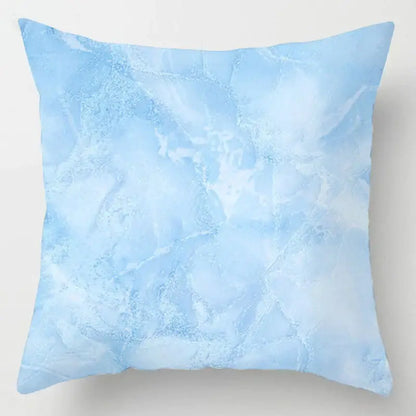 A square throw pillow with a soft icy blue geometric marble stripe pattern for decorbites blue geometric living room decor