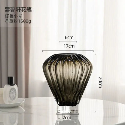 A sleek brown-tinted glass hot air balloon vase with fluted ribbed design and clear base for living room decor