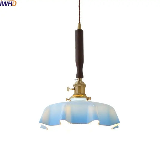 Blue glass led pendant lamp with brass fixture and dark wooden handle for dining room decorbites blue glass lighting