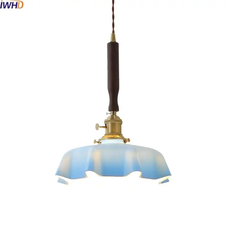 Blue glass led pendant lamp with brass fixture and dark wooden handle for dining room decorbites blue glass lighting