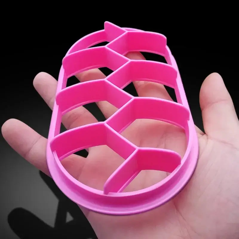 Bright pink plastic pineapple-shaped cookie cutter with honeycomb pattern for baking tool and oval bread molds