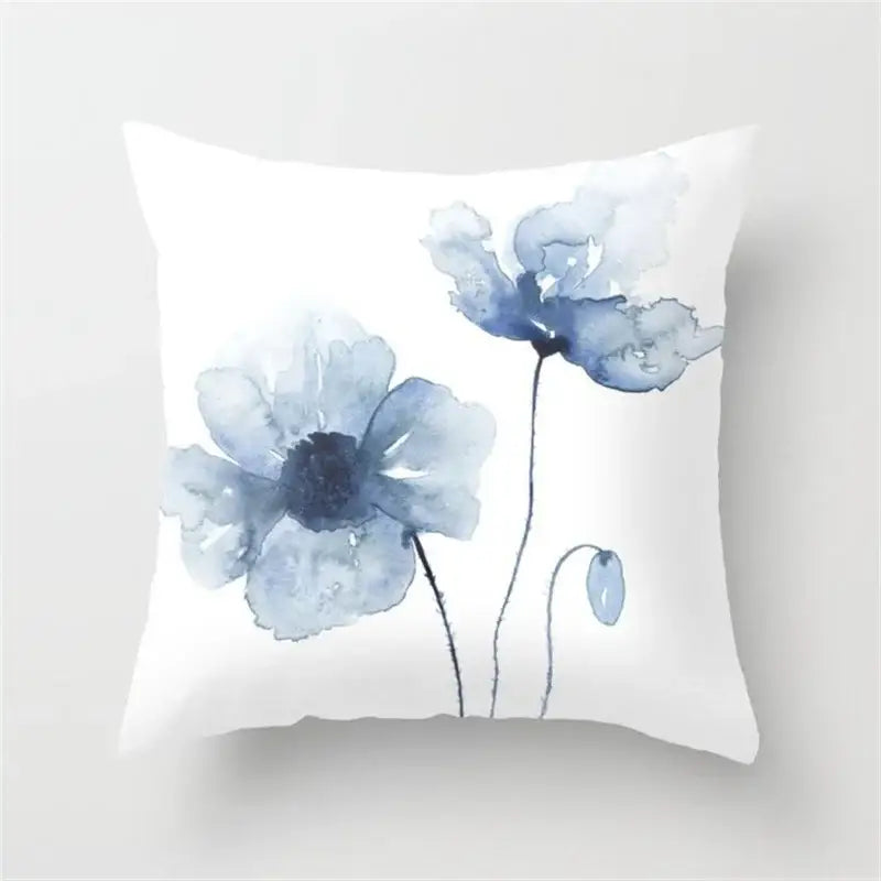 White throw pillow with blue ink flower watercolor design featuring delicate blue poppies for living room decorbites decor