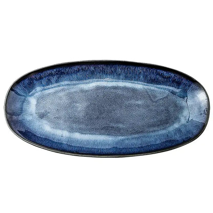 Blue kiln glazed oval ceramic sushi plate with gradient navy to light blue glaze and textured ridges by decorbites
