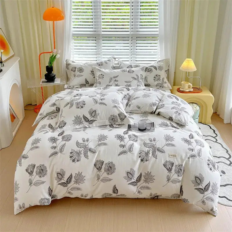 White duvet cover with gray floral pattern and matching pillowcases made of soft cotton for decorbites cotton stripe comforter set