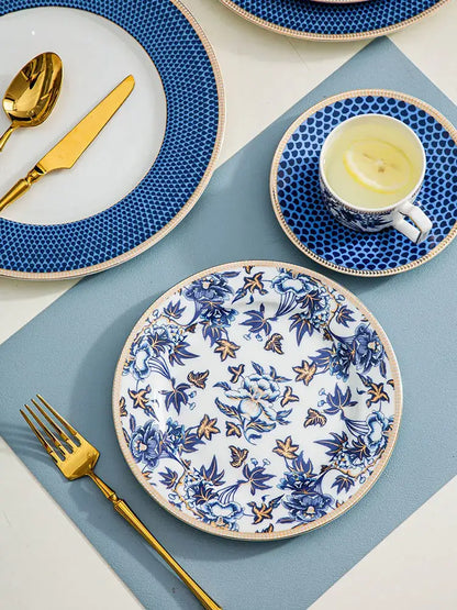 Blue lotus dinnerware porcelain plate with intricate blue white floral design accented in gold and black for decorbites blue lotus