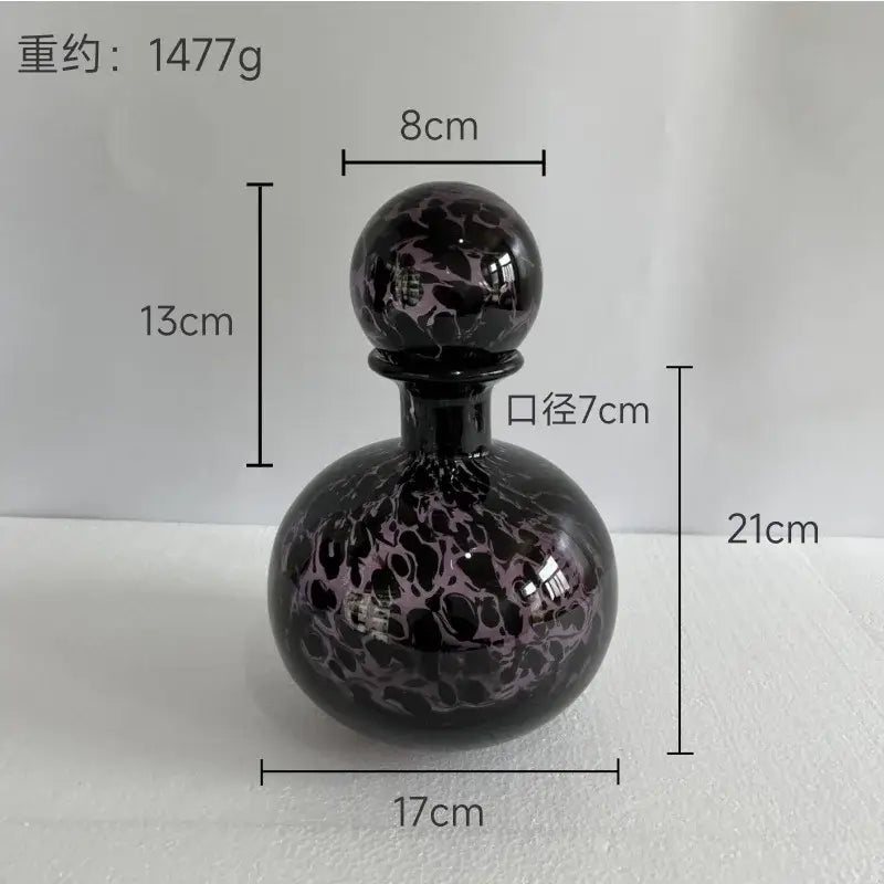A sleek teal and black marbled leopard print glass vase with lid decorbites leopard print for living room decor