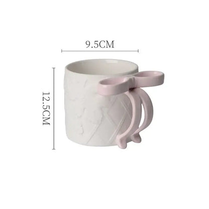 White decorbites bowknot ceramic mug with pink bow handle and textured pattern in saucer set for dining room tea cup