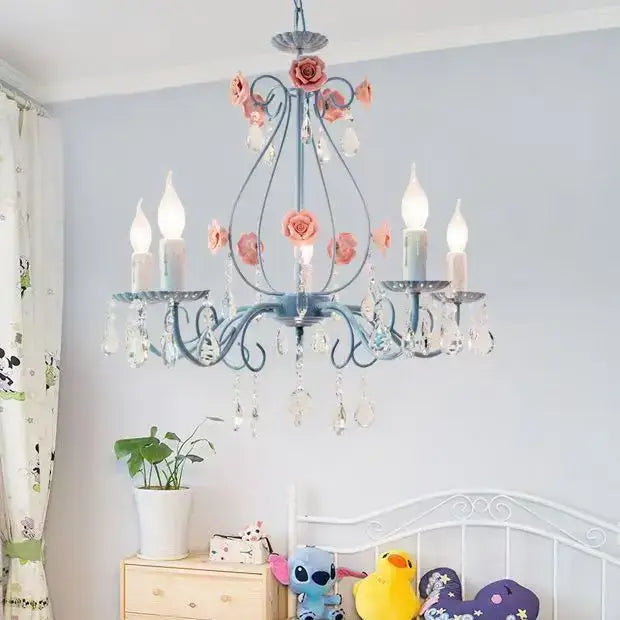 A delicate blue wrought iron pendant light with pink ceramic roses and crystal droplets decorbites blue crystal bouquet
