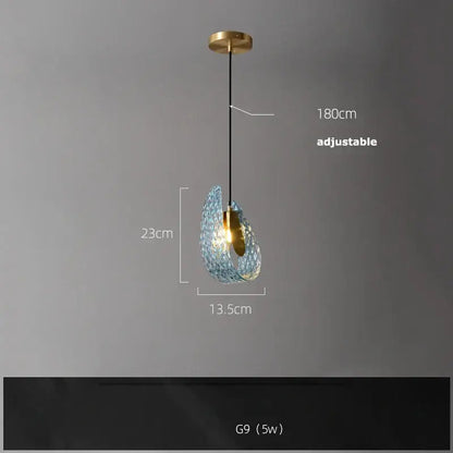 A delicate teardrop-shaped decorbites blue queen pendant light with translucent blue crystal glass and gold-toned accents
