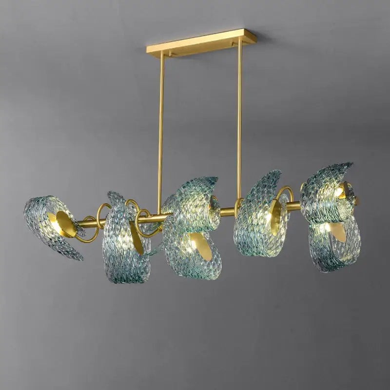 A modern decorbites blue queen crystal glass chandelier with five blue and green textured glass shades and brass rods