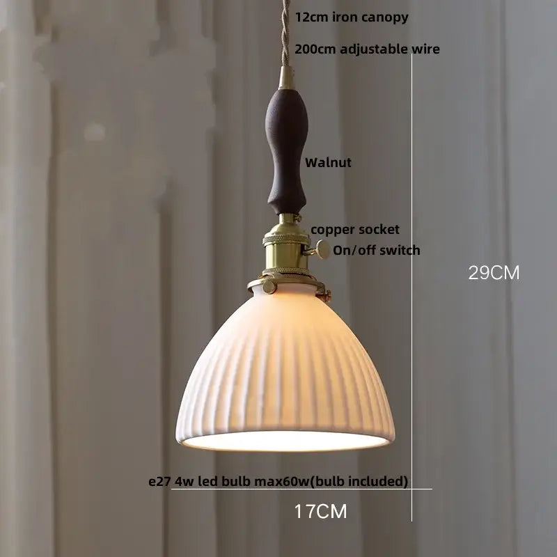 A warm-toned blue ribbed ceramic led pendant lamp with walnut iron canopy and brass hardware for kitchen lighting decorbites ceramic led