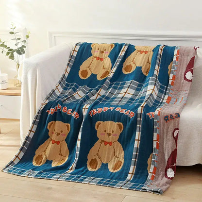 Blue teddy bear gauze cotton bath towel featuring embroidered tan teddy bears with red bow ties and plaid border patterns