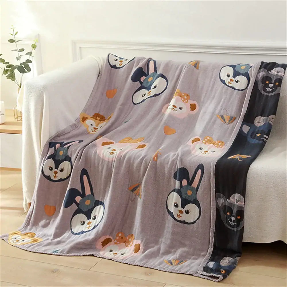 A soft lavender fleece bath towel featuring playful penguins and rabbits with bows accented by orange hearts