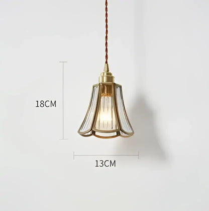 A delicate blue translucent glass pendant light with brass fixture and braided cord by decorbites pendant lights