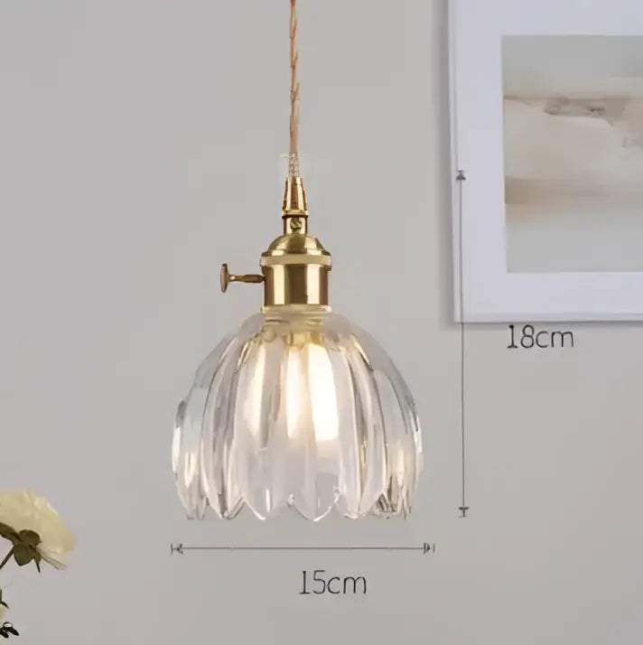 A vintage-style pendant light with a brass fixture and clear faceted glass shade by decorbites pendant lights