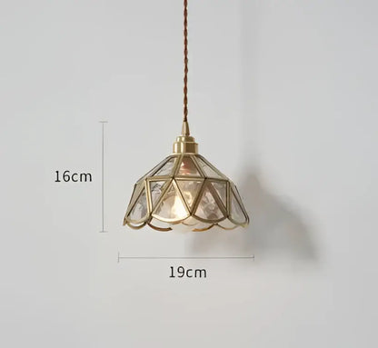 Blue translucent glass pendant lights with brass fixture featuring geometric faceted shade emitting warm glow decorbites pendant lights