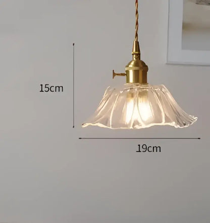 Blue translucent glass pendant lights with brass fixture featuring a vintage-style clear fluted glass shade decorbites pendant lights