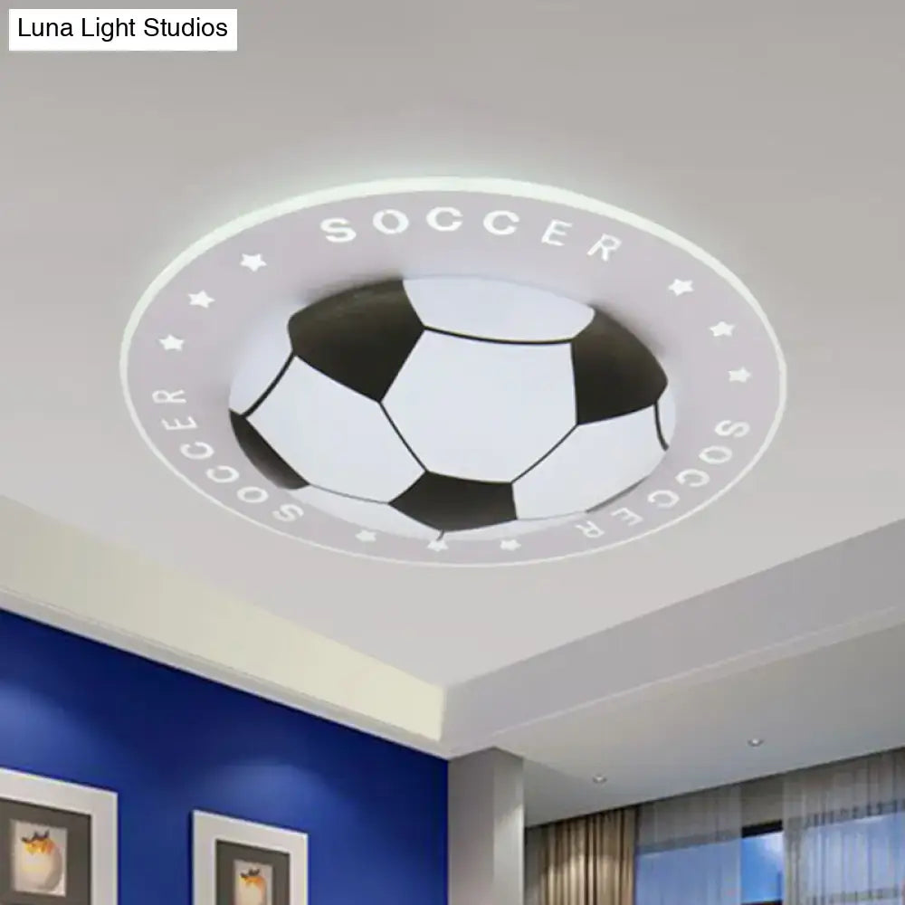 DecorBites™ kids led flush mount spotlight with black and white soccer ball design and repeated soccer lettering