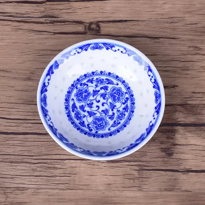 White porcelain dragon pattern dish set bowl with intricate blue floral designs and perforated decorative rim