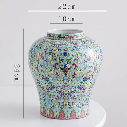 A decorative blue white porcelain floral vase with intricate pink yellow green and gold patterns for living room decor