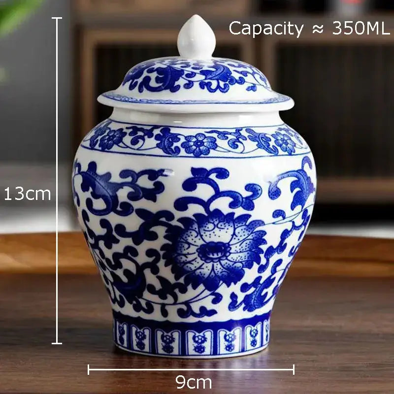 Classic blue and white porcelain tea canister with intricate floral patterns and matching lid for kitchen storage