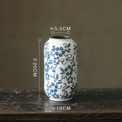 A white porcelain vase with delicate blue floral patterns and a rounded body for hydroponic living room decorbites blue white porcelain