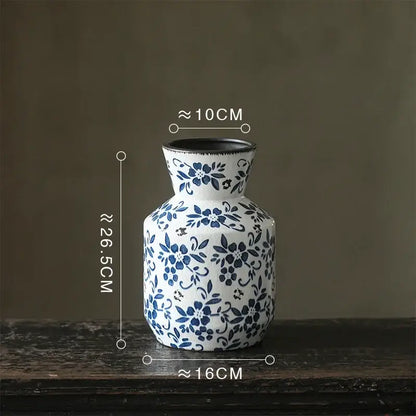 White porcelain vase with intricate blue floral patterns and black rim blue white porcelain decorbites hydroponic pot