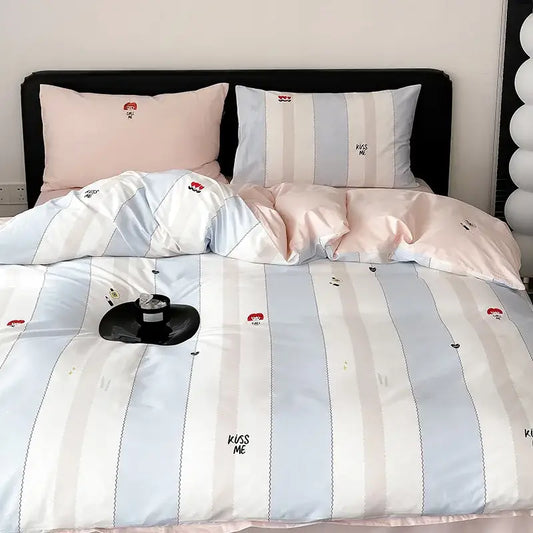 Pastel blue and white striped duvet cover set with embroidered kiss me text and small red cartoon faces for bedroom use