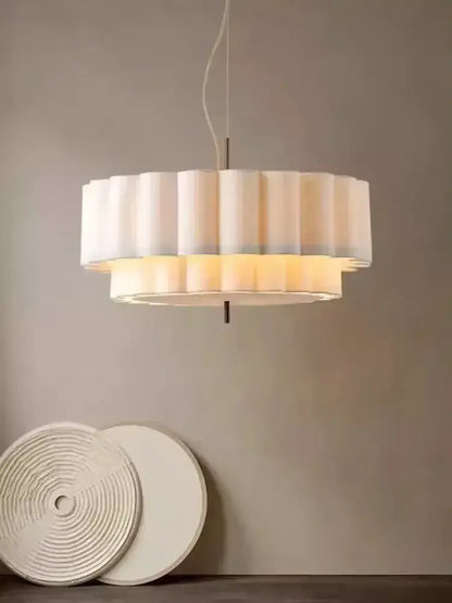 A modern two-tiered bohemia fabric chandelier pendant with soft white pleated shade and warm ambient glow for living room decorbites bohemia fabric
