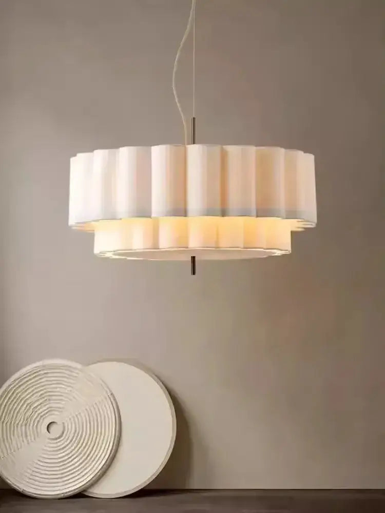 A modern two-tiered bohemia fabric chandelier pendant with soft white pleated shade and warm ambient glow for living room decorbites bohemia fabric