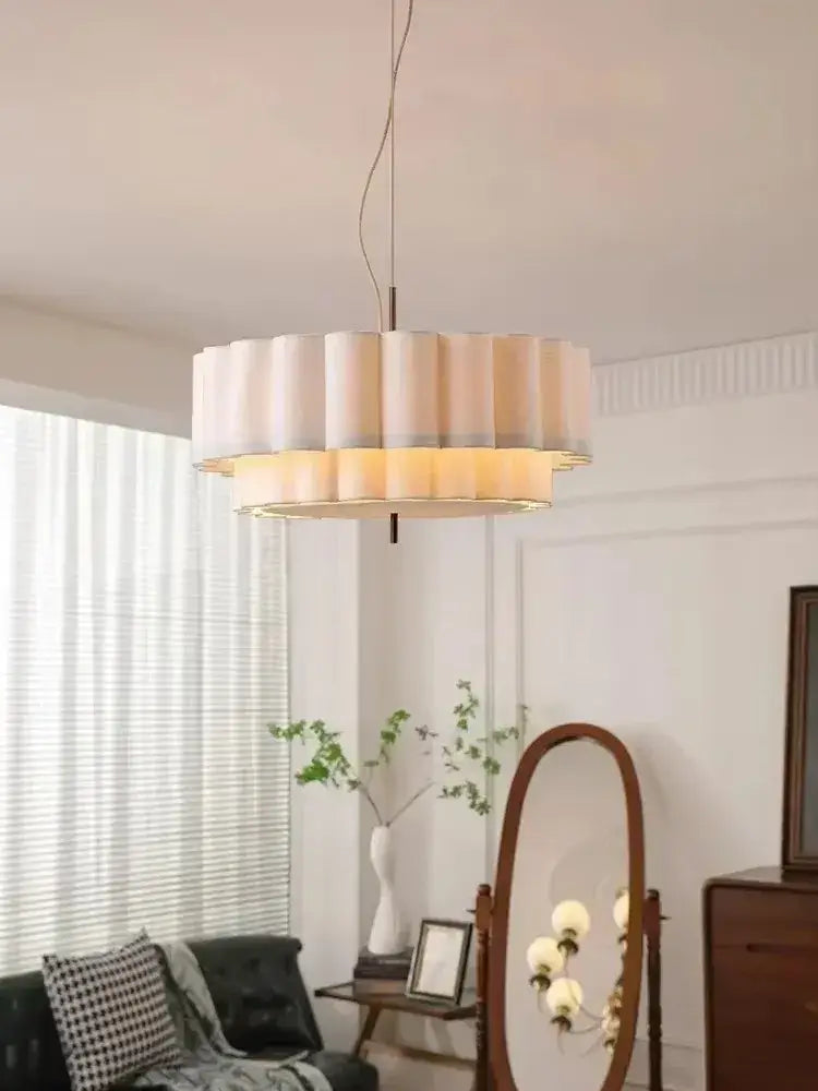 A modern two-tiered bohemia fabric chandelier pendant with cream pleated shade and warm illumination for living room decorbites