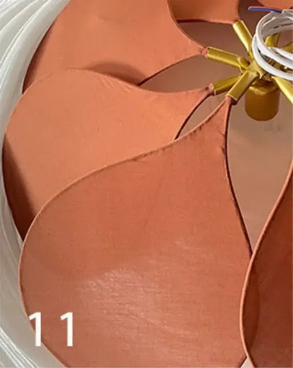 Tan leather fan blades with golden hub and white wiring in decorbites bohemia linen e27 cream flower pendant light