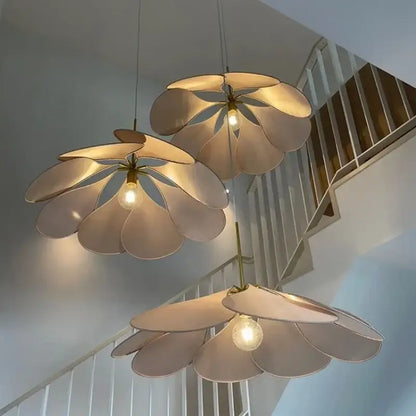 Three cream-colored bohemia linen e27 flower pendant lights with metallic stems hang from ceiling for bedroom decor
