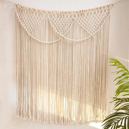 Cream-colored decorbites bohemia macrame cotton curtain with intricate woven patterns and long flowing fringe wall hanging