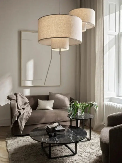 Beige linen tiered pendant lights with modern stacked cylindrical design for dining room decorbites bohemia wabi sabi