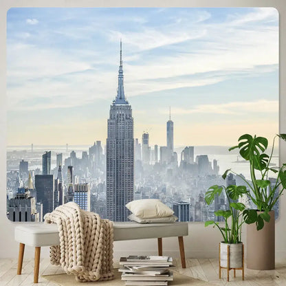 A beige knit throw blanket draped over a light gray bench with wooden legs decorbites bohemian art tapestry