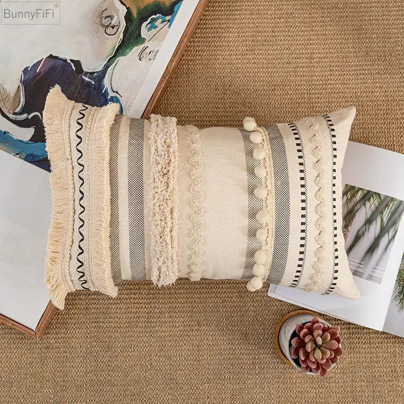 Bohemian beige cushion cover with beige and gray stripes, textured fringe, pom-poms, and embroidered details for decorbites bohemian beige decor