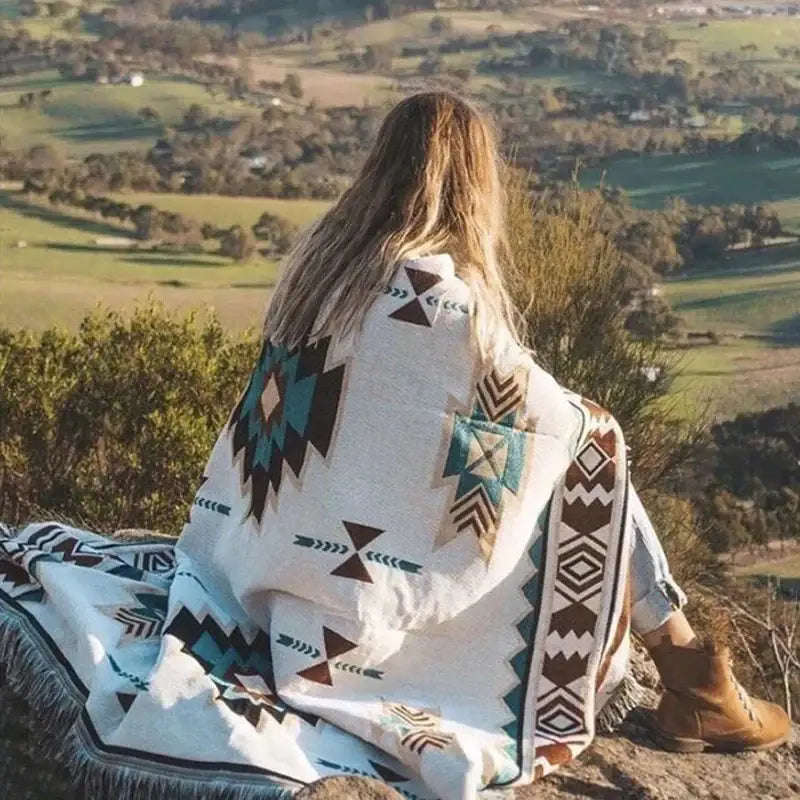 Bohemian sofa blanket by decorbites featuring a cozy off-white woven fabric with vintage plaid geometric patterns and fringed edges