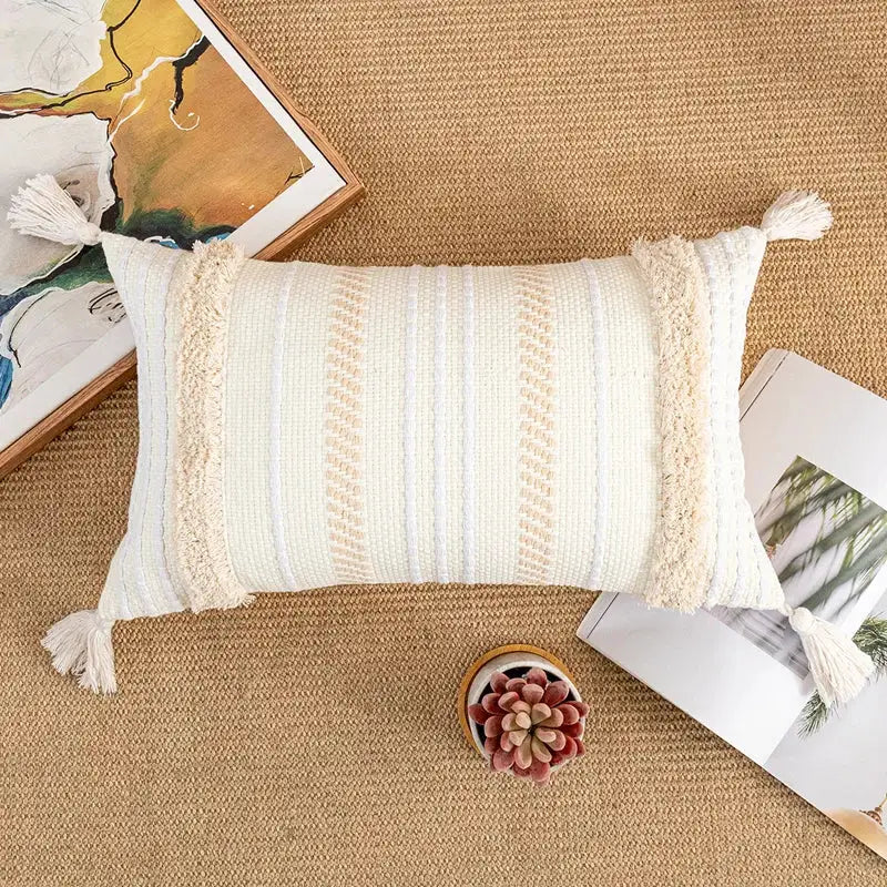 Cream-colored rectangular cushion cover with textured woven stripes and fringed tassels by decorbites bohemian beige for home decor
