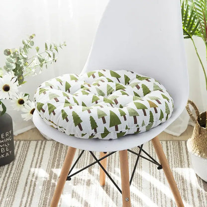 Round plush meditation cushion pouf with white base and green pine tree pattern for bohemian living room decor