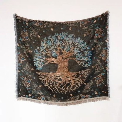 Bohemian camping blanket by decorbites features a dark green tapestry with tree of life and floral patterns for living room decor
