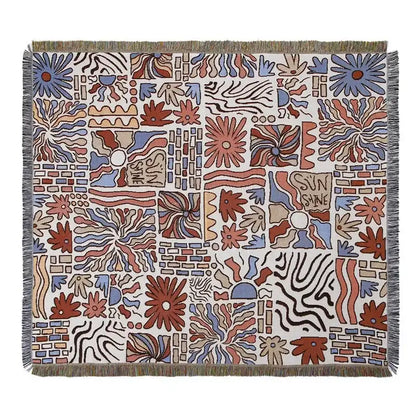 A decorbites bohemian camping blanket with vibrant floral and geometric rust blue beige patterns on off-white background