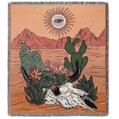 A decorbites bohemian camping blanket featuring a woven desert scene with cacti and sun motif on yellow background