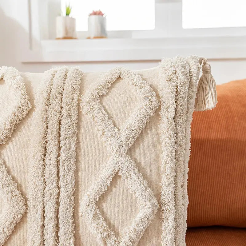 Cream-colored textured cushion cover with diamond tassel fringe design for living room decor by decorbites bohemian tassel